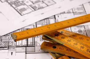 Architecture planning of interiors with metre, metre is on focus